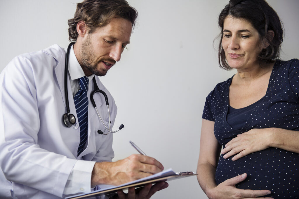 Doctor explaining IVF after c section possibilities and risks